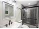 Bathroom with gray herringbone tile shower and white vanity at 139 Elysian Dr, Mooresville, NC 28117