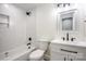 Modern bathroom with white herringbone tile and updated vanity at 139 Elysian Dr, Mooresville, NC 28117