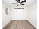 Bedroom with ceiling fan and barn door closet at 139 Elysian Dr, Mooresville, NC 28117