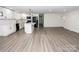 Spacious kitchen with white cabinets, an island, and luxury vinyl plank flooring at 139 Elysian Dr, Mooresville, NC 28117