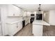 Modern kitchen with white cabinets, quartz countertops, and stainless steel appliances at 139 Elysian Dr, Mooresville, NC 28117