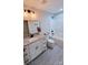 Modern bathroom with granite countertop, white cabinets, and a bathtub at 1460 23Rd Sw St, Hickory, NC 28602