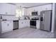 Modern kitchen featuring white cabinets, stainless steel appliances, and granite countertops at 1460 23Rd Sw St, Hickory, NC 28602