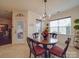 Bright dining area with four chairs, chandelier, and access to patio at 156 Carmen Way # 70, Lancaster, SC 29720