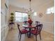 Charming dining room with round table, four chairs, and chandelier at 156 Carmen Way # 70, Lancaster, SC 29720