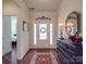 Elegant entryway with hardwood floors, decorative mirror, and a view of a bedroom at 156 Carmen Way # 70, Lancaster, SC 29720