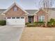 Brick front exterior with two-car garage and landscaped yard at 156 Carmen Way # 70, Lancaster, SC 29720