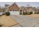 Brick home with two-car garage and driveway, located in a neighborhood at 156 Carmen Way # 70, Lancaster, SC 29720