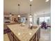 Kitchen island with granite countertop and breakfast bar seating at 156 Carmen Way # 70, Lancaster, SC 29720