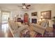 Bright living room with hardwood floors and a gas fireplace at 156 Carmen Way, Lancaster, SC 29720