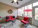 Relaxing screened porch with red furniture and ceiling fan at 156 Carmen Way # 70, Lancaster, SC 29720