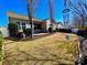 Outdoor living space with patio, grill, and seating, complemented by a landscaped yard at 156 Carmen Way, Lancaster, SC 29720