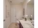 Clean bathroom with a white toilet, vanity, and a decorative mirror at 156 Carmen Way, Lancaster, SC 29720