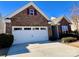 Spacious two-car garage with brick facade and a concrete driveway at 156 Carmen Way, Lancaster, SC 29720