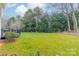 Landscaped backyard with grassy area at 15604 Wynford Hall St, Huntersville, NC 28078