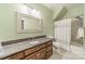 Bathroom with single vanity, tub, and shower at 15604 Wynford Hall St, Huntersville, NC 28078