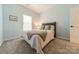 Serene bedroom with a double bed and calming blue walls at 15604 Wynford Hall St, Huntersville, NC 28078