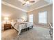 Spacious bedroom with carpeted floor and ceiling fan at 15604 Wynford Hall St, Huntersville, NC 28078