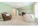 Comfortable bonus room with seating and a TV at 15604 Wynford Hall St, Huntersville, NC 28078