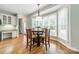 Charming breakfast nook with wood table and chairs by window at 15604 Wynford Hall St, Huntersville, NC 28078