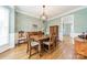 Formal dining room with hardwood floors and an elegant chandelier at 15604 Wynford Hall St, Huntersville, NC 28078