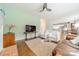 Gathering room with fireplace, hardwood floors and view into kitchen at 15604 Wynford Hall St, Huntersville, NC 28078