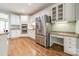 Modern kitchen with stainless steel appliances and white cabinets at 15604 Wynford Hall St, Huntersville, NC 28078