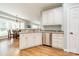 White kitchen with stainless steel appliances and granite countertops at 15604 Wynford Hall St, Huntersville, NC 28078