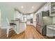 Stainless steel appliances and white cabinets in a spacious kitchen at 15604 Wynford Hall St, Huntersville, NC 28078