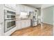 Updated kitchen, featuring stainless steel appliances and white cabinets at 15604 Wynford Hall St, Huntersville, NC 28078