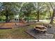 playground with play structures and picnic tables at 15604 Wynford Hall St, Huntersville, NC 28078