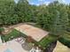 Community sand volleyball court with surrounding trees and seating area at 15604 Wynford Hall St, Huntersville, NC 28078