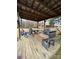 Rustic covered patio with picnic table and grill at 166 Cheryls Pass None, Love Valley, NC 28625