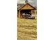 Wooden cabin with covered porch and picnic table, situated in a field at 166 Cheryls Pass None, Love Valley, NC 28625