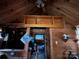 Cabin interior with wood-paneled walls and loft storage at 166 Cheryls Pass None, Love Valley, NC 28625