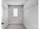 Large walk-in closet with wire shelving and grey carpet at 1709 Honey Trl, Monroe, NC 28112