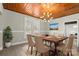 Bright dining room features wood ceiling, chandelier, and wood dining table with seating for six at 200 Church Dr, Shelby, NC 28150