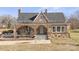 Stone house with arched entryway, porch, and large windows at 200 Church Dr, Shelby, NC 28150