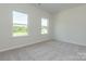 Bright bedroom with neutral walls and carpet, featuring two large windows at 2238 Catawba Trace Dr, Catawba, NC 28609