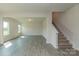 Spacious Gathering room with vinyl plank flooring and staircase to upper level at 2238 Catawba Trace Dr, Catawba, NC 28609