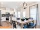 Open concept dining area with kitchen view and modern light fixture at 2246 Catawba Trace Dr, Catawba, NC 28609