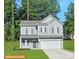 Two-story house with gray siding, two-car garage, and a well-maintained lawn at 2246 Catawba Trace Dr, Catawba, NC 28609