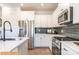 Modern kitchen with white cabinets, stainless steel appliances, and an island at 2246 Catawba Trace Dr, Catawba, NC 28609