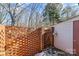 Brick wall, wooden gate, and storage shed in backyard at 232 14Th Se Ave # E, Hickory, NC 28502