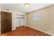 Simple bedroom with hardwood floors and a large closet at 232 14Th Se Ave # E, Hickory, NC 28502