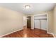 Bright bedroom featuring hardwood floors and a spacious closet at 232 14Th Se Ave # E, Hickory, NC 28502