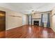 Living room with hardwood floors, fireplace and ceiling fan at 232 14Th Se Ave # E, Hickory, NC 28502