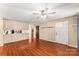 Living room with hardwood floors, ceiling fan and access to kitchen at 232 14Th Se Ave # E, Hickory, NC 28502