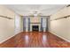 Living room with hardwood floors, fireplace and ceiling fan at 232 14Th Se Ave # E, Hickory, NC 28502