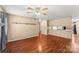 Living room with hardwood floors, fireplace and ceiling fan at 232 14Th Se Ave # E, Hickory, NC 28502